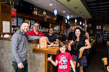 Perrella family inside restaurant 