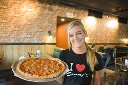 Fresh sammy's pizza on outdoor table